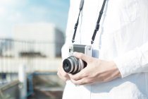Person with vintage camera — Stock Photo