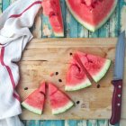 Slices of watermelon on board — Stock Photo