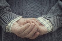 Man holding hands behind — Stock Photo