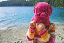 Girl pulling her hat down — Stock Photo