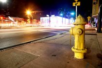 Yellow fire hydrant — Stock Photo