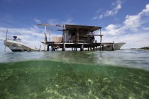 Fishing shed seen from sea surface — Stock Photo