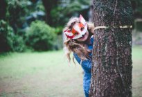 Teenage girl wearing fox mask — Stock Photo