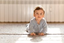 Baby boy on floor — Stock Photo
