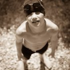 Swimmer in race gear looking up — Stock Photo
