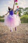 Girl in pink tutu jumping in air — Stock Photo