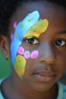Girl with face paint — Stock Photo
