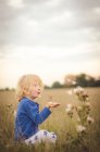 Young boy in field — Stock Photo