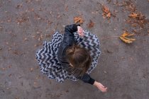 Overhead view of a Girl spinning around — Stock Photo