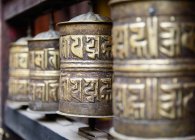 Prayer wheels in temple — Stock Photo