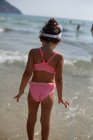 Girl standing in sea — Stock Photo