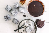 Chocolate lamingtons in process — Stock Photo