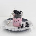 Yogurt topped with blueberries — Stock Photo