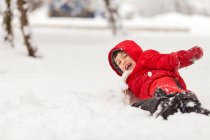 Boy playing in the snow — Stock Photo