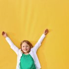 Girl with her arms in the air — Stock Photo