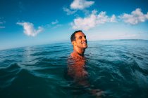 Portrait of smiling man in Ocean — Stock Photo