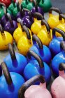 Multi-colored kettlebells weights in gym — Stock Photo