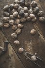 Walnuts, hammer and nutcracker — Stock Photo