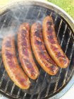 Sausages on  barbecue grill — Stock Photo