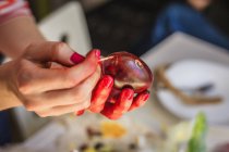 Womans hands painting Easter eggs — Stock Photo