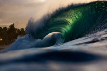 Wave breaking along reef — Stock Photo