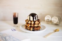 Waffles with ice-cream and sauce — Stock Photo