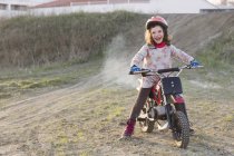Girl riding motorbike — Stock Photo