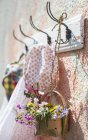 Spring girlish clothes on hanger on wall — Stock Photo