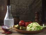 Sauerkraut, pickled tomatoes and cucumbers — Stock Photo
