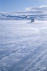 Vehicles driving through snow — Stock Photo