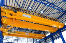Low angle view of crane in factory — Stock Photo
