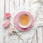 Cup of Tea with roses and lace, top view — Stock Photo