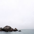 Scenic view of rocks in sea, copy space — Stock Photo
