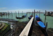 Italy, Venice, scenic view of gondolas parking — Stock Photo