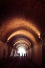 People walking in tunnel, Italy, Monterosso — Stock Photo