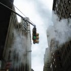 Foggy traffic light with buildings facades on background, USA, New York — Stock Photo