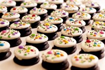 Rows of white and dark chocolate cookies — Stock Photo