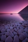 Scenic view of pebbles and still reservoir, Lisbon, Portugal — Stock Photo