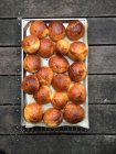 Tray of freshly baked rolls on a cooling rack — Stock Photo