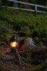 Scenic view of illuminated oil lamp in field — Stock Photo