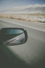 Reflection of car in side view mirror — Stock Photo