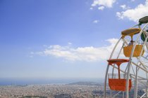 Spain, Barcelona, Elevated view of city with cabins of ferris wheel — Stock Photo