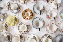 Various Provence vintage cups and saucers and spoons — Stock Photo