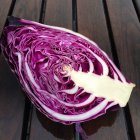 Close-up of half a red cabbage on a table — Stock Photo