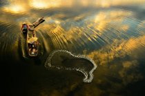 Two fishermen casting a net in river at sunrise, Thailand — Stock Photo