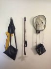 Bags, hats, umbrella, dog collar and dog lead hanging on wall — Stock Photo