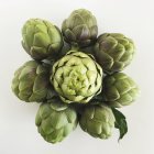 Artichokes in a flower pattern, food conncept — Stock Photo