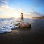Two caucasian boys spending time on ocean beach — Stock Photo