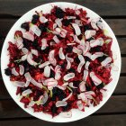 Salad with red cabbage, radish and blackberries — Stock Photo