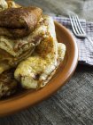 Close-up of Stuffed pancakes in plate on a wooden table — Stock Photo